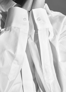 Details of the white Boyfriend Shirt by Gaiavittoria. Mother of pearl buttons.